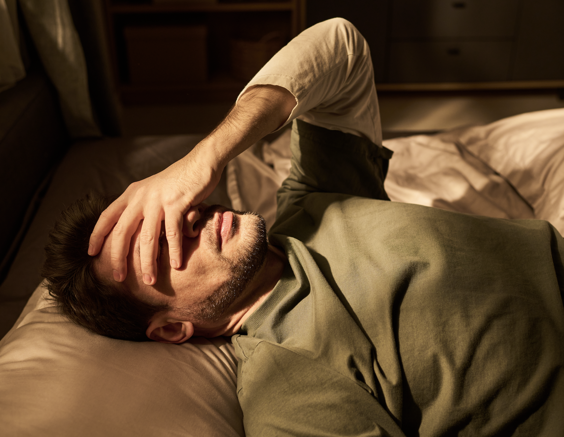 Frustrated man thinking is partner is withholding sex
